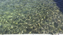 Clear water with rocks at the bottom
